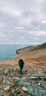 Scenic view of coastal landscape with lone hiker and rolling hills.
