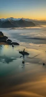 Misty coastal mountain landscape at sunset with golden reflections.