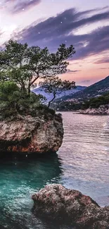 Serene coastal rock at sunset with tranquil waters and vivid sky.