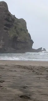 Mobile wallpaper of a coastal rock and beach scene