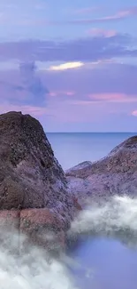 Serene wallpaper with coastal rocks and purple sky.