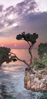 Wallpaper of a tree on a cliff at sunset, overlooking the ocean.