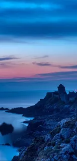 Serene coastal sunset with rocky shoreline and pastel sky hues.