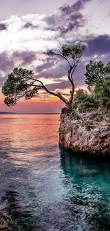 Serene coastal sunset with vibrant twilight colors and calm ocean waves.