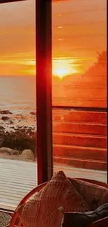 Serene sunset view from a window with ocean and warm colors.