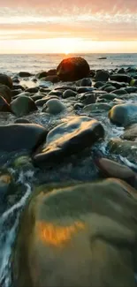 A serene sunset view with rocks and ocean waves