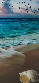 Serene coastal landscape with ocean, beach, sunset, and birds in flight.