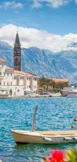 Scenic coastal town with blue waters and mountains.