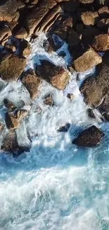 Aerial view of ocean waves crashing onto a rocky shoreline, creating a serene coastal scene.