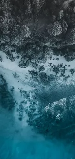 Aerial view of a serene rocky coastline and blue ocean.