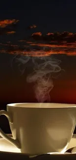 Steaming coffee cup with sunset backdrop, perfect mobile wallpaper.