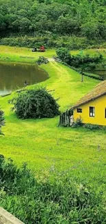 Countryside landscape with yellow house and green fields.