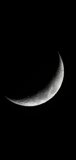 Serene crescent moon against a dark sky.