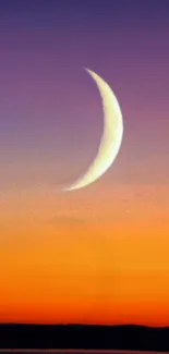 Crescent moon against a sunset sky in orange and purple hues.