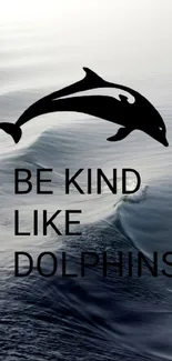 Serene ocean wallpaper with a dolphin and 'Be Kind Like Dolphins' text.