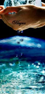 Hands holding a globe with water dripping into a pool.