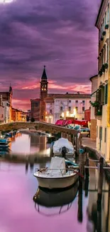 Serene evening canal view with vibrant sunset.