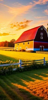 Mobile wallpaper of vibrant sunset over a farm with a red barn and green fields.