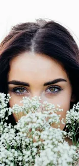 Portrait wallpaper with flowers and captivating eyes.