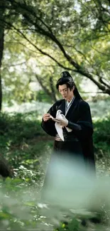 Person in traditional attire holding a bird in a lush green forest setting.