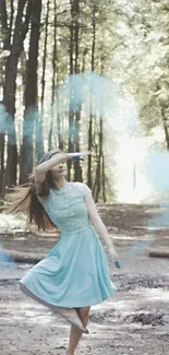 Woman in blue dress dancing in a sunlit forest path.