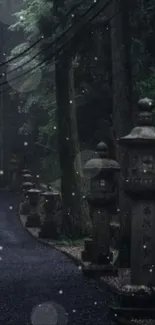 Misty forest path with stone lanterns and lush greenery.