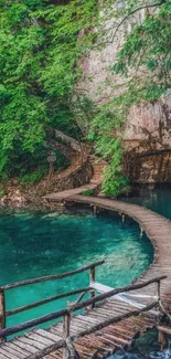 Wooden path through green forest over blue water.