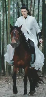 Person in white riding a horse through a forest.