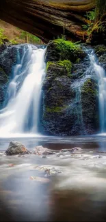 Serene waterfall in a lush forest setting, perfect for mobile wallpaper.