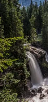 Majestic waterfall flows through a lush green forest.