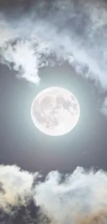 Full moon with glowing clouds in a serene night sky.