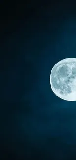 Full moon in a dark blue night sky wallpaper.