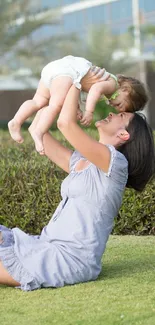 Mother and child enjoy playtime in a sunlit garden surrounded by greenery.