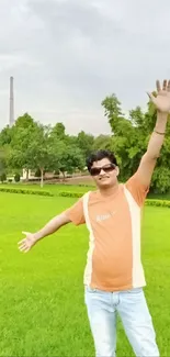 Person enjoying a sunny day in a lush green park.