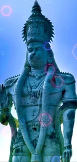 Serene Hanuman statue with blue hues and hexagon lights on phone wallpaper.