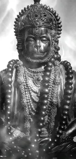 Monochrome Hanuman statue with intricate details.