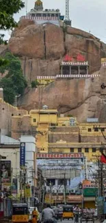 Hilltop temples and bustling city street view.