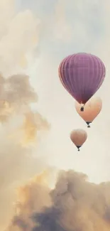 Hot air balloons floating in a serene, cloudy sky background.