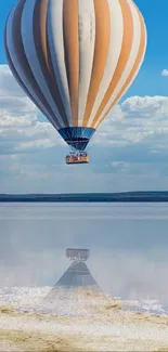 Hot air balloon floating over serene salt flats under a sky blue sky.