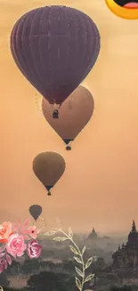 Hot air balloons over ancient city at sunset.