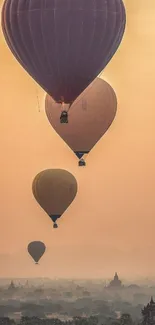 Hot air balloons float over temples at sunrise in serene landscape.