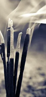 Serene incense smoke rising in sepia tones on a minimalist wallpaper.