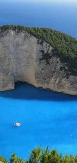 A serene island surrounded by vibrant blue sea with a small white boat.