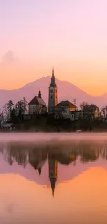 Serene church and island reflection at sunset.