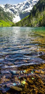 Peaceful mountain lake under vibrant sky with clear water.