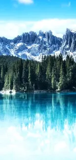 Blue lake with snowy mountains and pine forest under a clear sky.