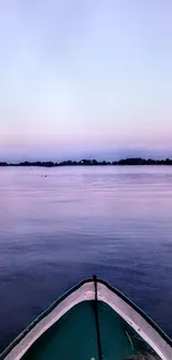 Serene boat on a twilight lake with purple hues.