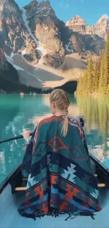 Peaceful lake canoeing under majestic mountains.