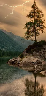 Calm lake with tree and mountains under a stormy sky.