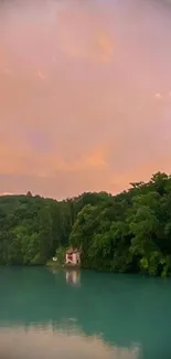 Serene lake at sunset with vibrant skies and lush green trees.